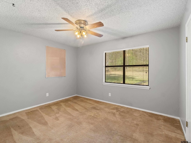 unfurnished room with carpet, a textured ceiling, and ceiling fan