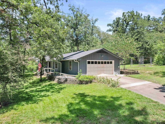 view of front of house featuring a garage and a front lawn