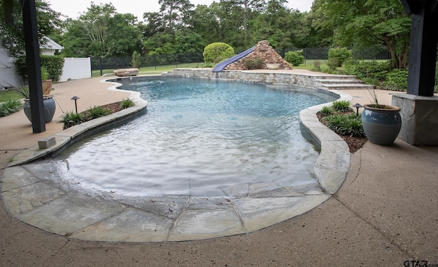 18722 Ridgeline Rd, Tyler, TX 75703 - view of pool with a fenced backyard, a patio area, and a water slide