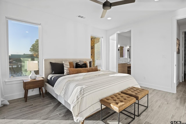 331 W Eagle Pt, Mount Vernon, TX 75457 - bedroom with light wood-type flooring, a ceiling fan, baseboards, and visible vents