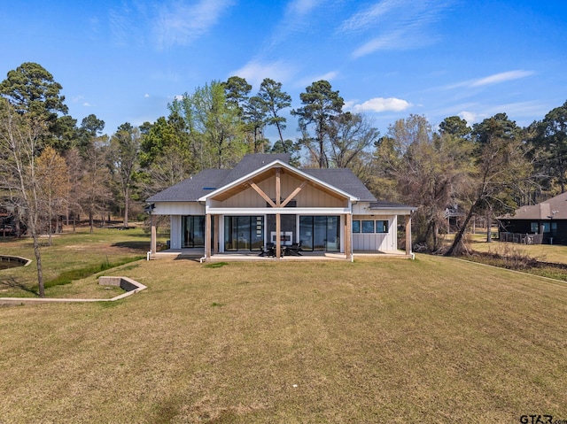331 W Eagle Pt, Mount Vernon, TX 75457 - rear view of house featuring a lawn, a patio, and board and batten siding