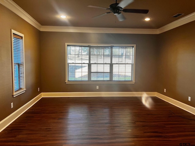 empty room with ceiling fan, dark hardwood / wood-style floors, and crown molding