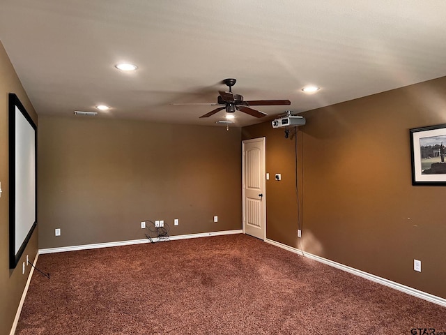 empty room with ceiling fan and carpet