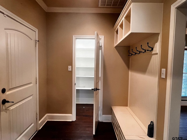 mudroom with dark hardwood / wood-style floors and crown molding