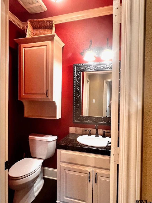 bathroom with vanity and toilet