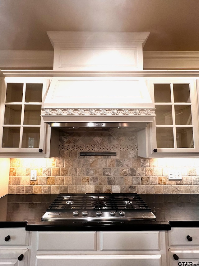 kitchen featuring white cabinetry, backsplash, custom exhaust hood, and stainless steel gas stovetop