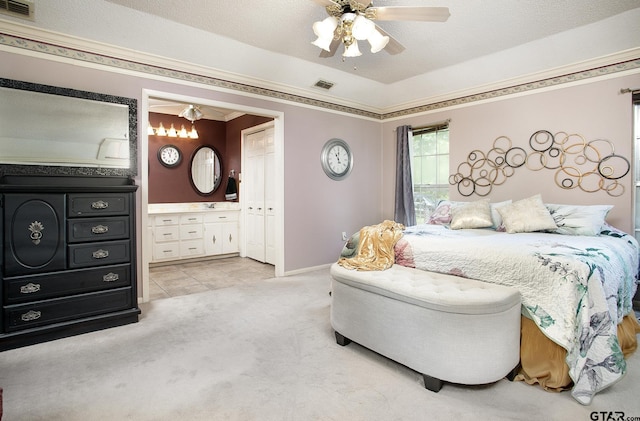 10187 Crestview Dr, Tyler, TX 75707 - bedroom with light colored carpet, ornamental molding, ensuite bath, and ceiling fan