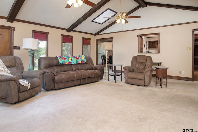 10187 Crestview Dr, Tyler, TX 75707 - carpeted living area with ceiling fan, beam ceiling, a skylight, and high vaulted ceiling