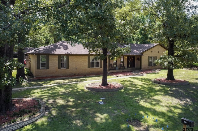 10187 Crestview Dr, Tyler, TX 75707 - single story home with a front yard and brick siding