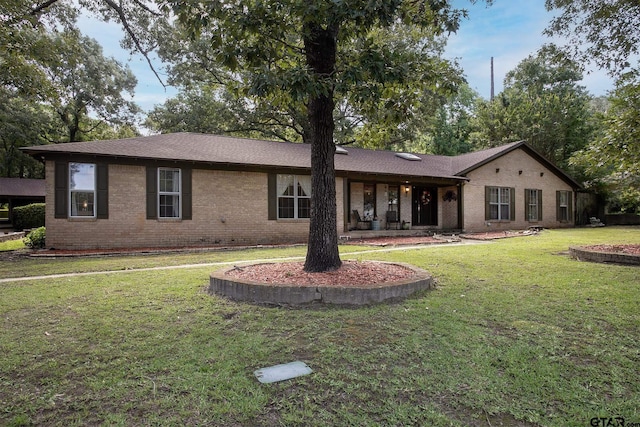 10187 Crestview Dr, Tyler, TX 75707 - ranch-style house featuring a front yard and brick siding