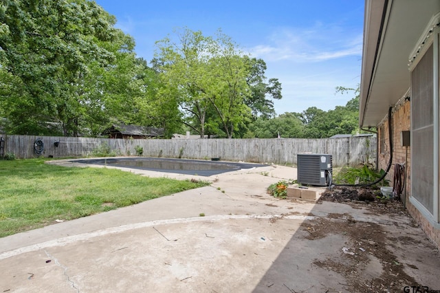 view of patio featuring central AC unit and a fenced backyard