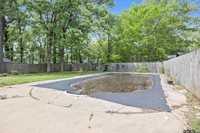 view of swimming pool featuring a patio and a fenced backyard
