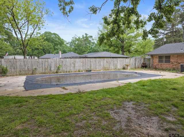 view of pool with a lawn, a fenced in pool, and a fenced backyard