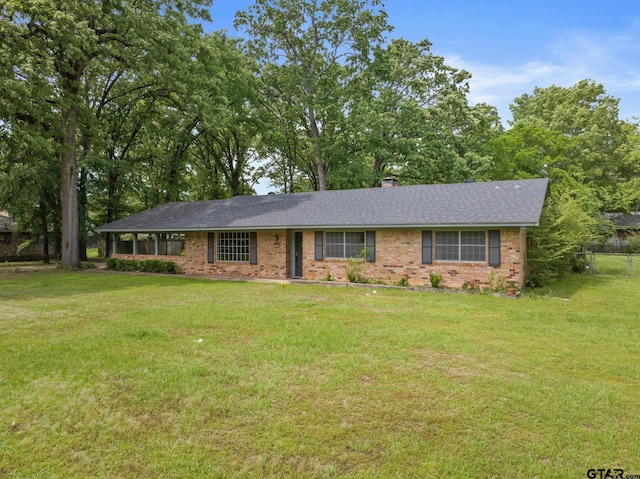 2005 Happy St, Mount Pleasant, TX 75455 - single story home featuring brick siding, a front yard, and roof with shingles