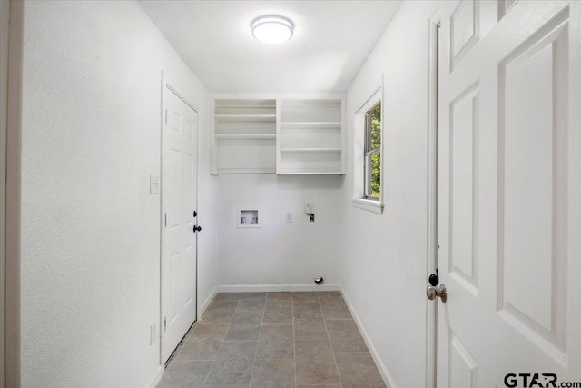washroom featuring baseboards, laundry area, and hookup for a washing machine