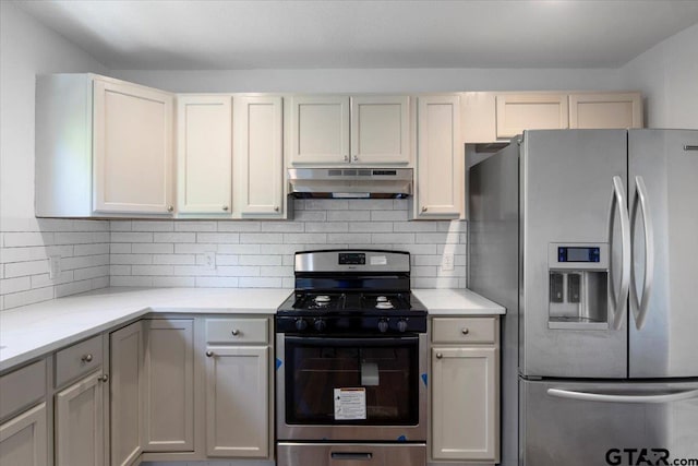 kitchen with light countertops, under cabinet range hood, and appliances with stainless steel finishes