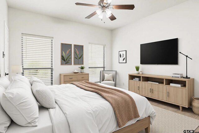 4601 Dickens, Athens, TX 75751 - bedroom featuring light wood-style floors, multiple windows, and a ceiling fan