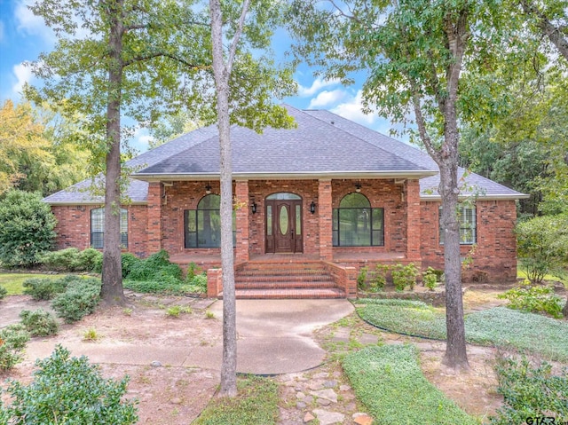 single story home with covered porch