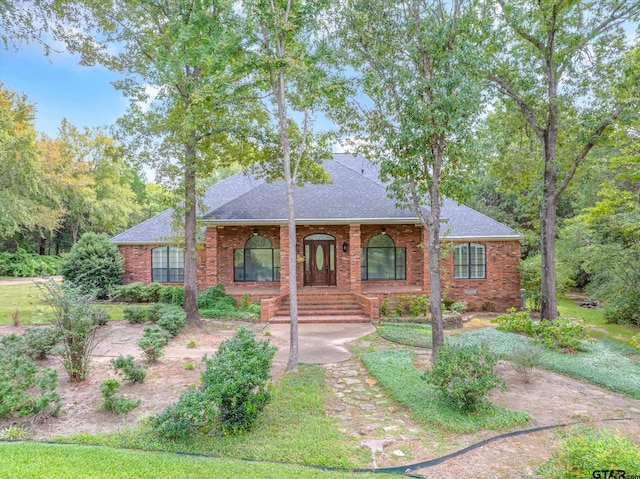 single story home with a porch