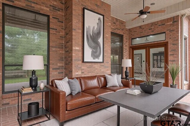 4601 Dickens, Athens, TX 75751 - living room featuring brick wall and a ceiling fan