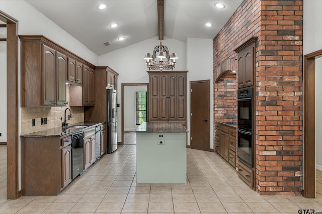 kitchen featuring dark stone counters, black appliances, a chandelier, sink, and light tile patterned flooring