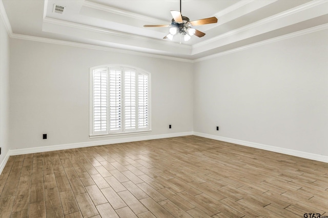 4601 Dickens, Athens, TX 75751 - empty room featuring a raised ceiling, a ceiling fan, wood finished floors, baseboards, and ornamental molding