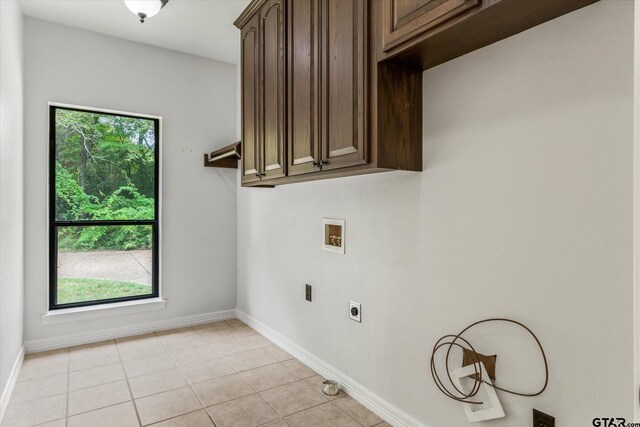 4601 Dickens, Athens, TX 75751 - washroom featuring hookup for a washing machine, hookup for an electric dryer, cabinet space, and baseboards