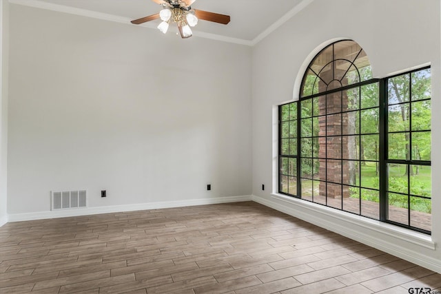 4601 Dickens, Athens, TX 75751 - unfurnished room featuring a ceiling fan, wood finished floors, baseboards, and ornamental molding