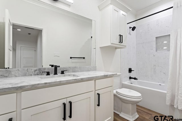 full bathroom with hardwood / wood-style floors, shower / bath combo, vanity, toilet, and ornamental molding