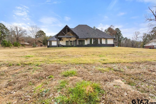 craftsman-style home with a front lawn