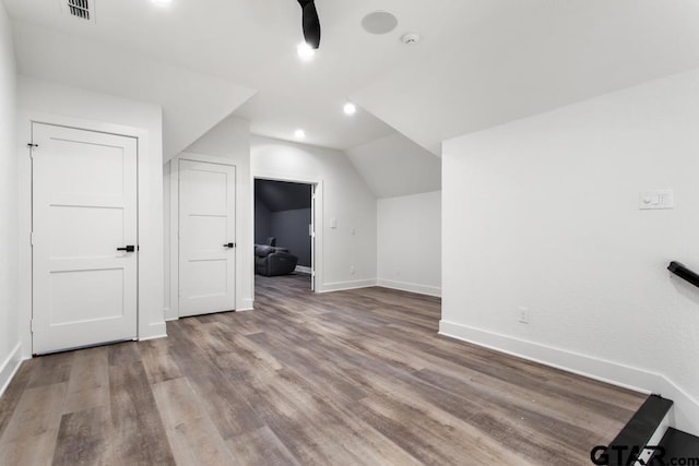 bonus room featuring light hardwood / wood-style flooring and vaulted ceiling