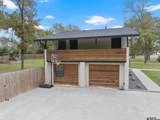 garage featuring a lawn