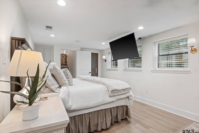 bedroom with light wood-type flooring