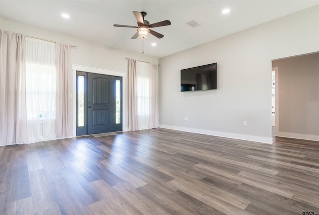 foyer entrance with wood-type flooring and ceiling fan