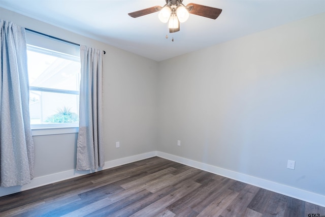 empty room featuring ceiling fan and dark hardwood / wood-style floors