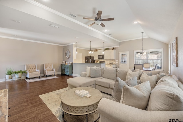 living room with visible vents, baseboards, ornamental molding, ceiling fan with notable chandelier, and dark wood-style flooring