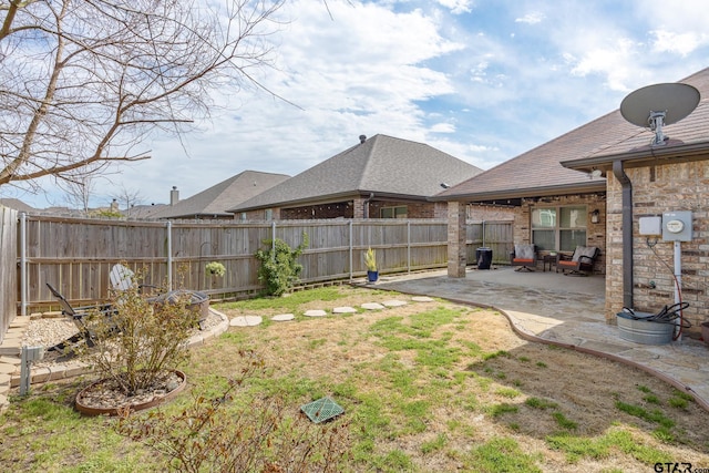 view of yard featuring a fenced backyard and a patio area