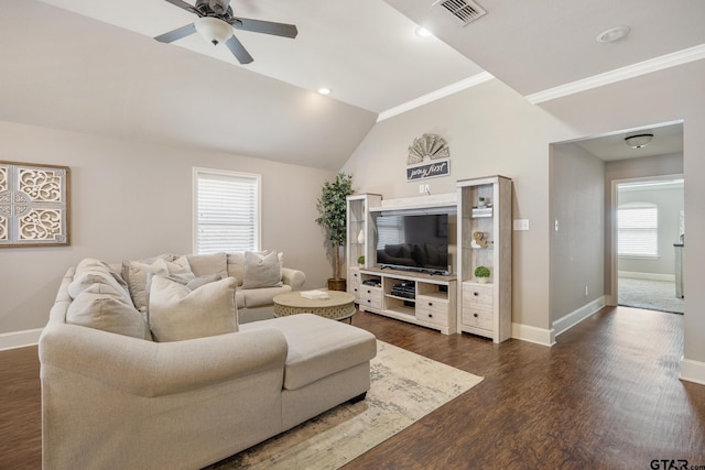 living area featuring visible vents, baseboards, dark wood-type flooring, and ceiling fan