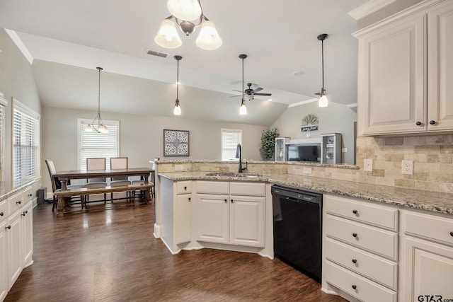 kitchen featuring visible vents, a sink, black dishwasher, a peninsula, and dark wood-style flooring