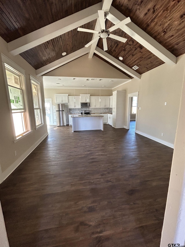 unfurnished living room featuring dark hardwood / wood-style flooring, vaulted ceiling with beams, ceiling fan, and wooden ceiling