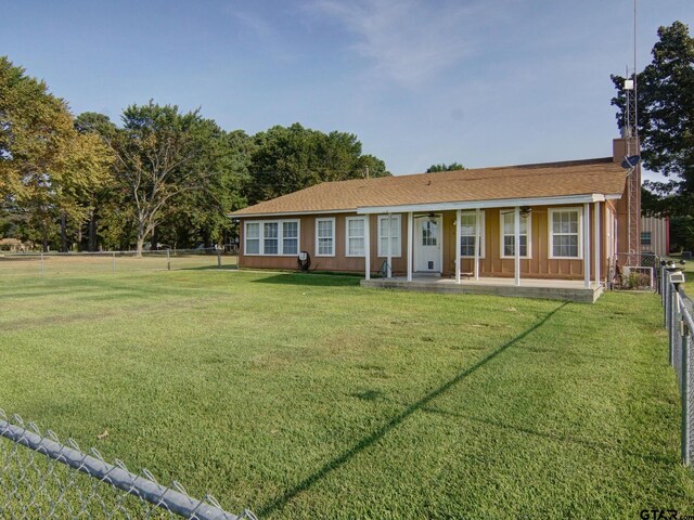 back of house with a yard, a patio area, ceiling fan, and fence