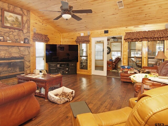 living area with hardwood / wood-style floors, vaulted ceiling, and plenty of natural light