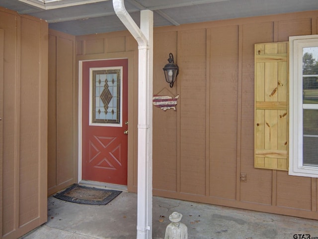 entrance to property featuring board and batten siding