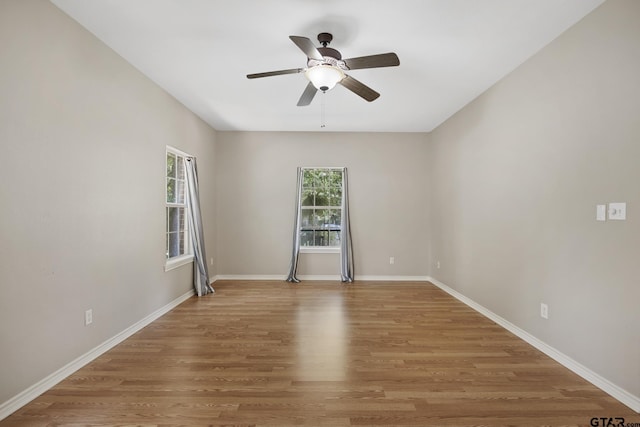 spare room featuring ceiling fan and hardwood / wood-style floors