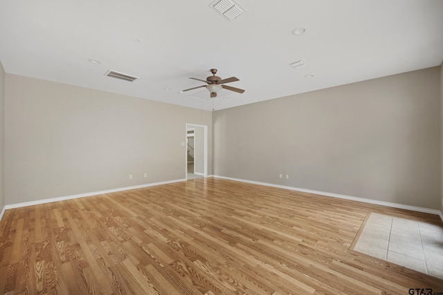 unfurnished room with light hardwood / wood-style flooring and ceiling fan