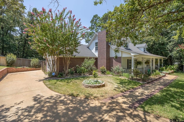 exterior space featuring a porch and a yard