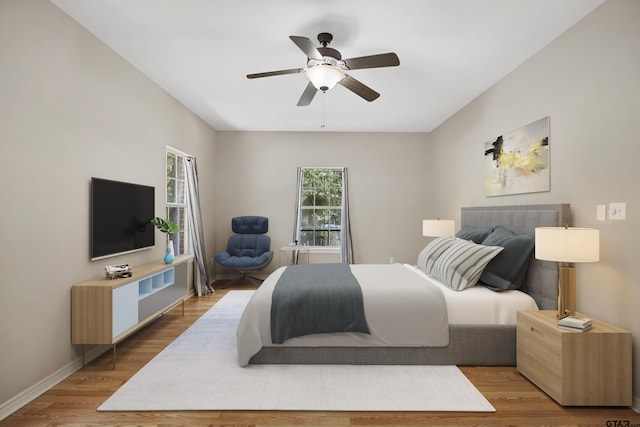 bedroom featuring ceiling fan and light wood-type flooring