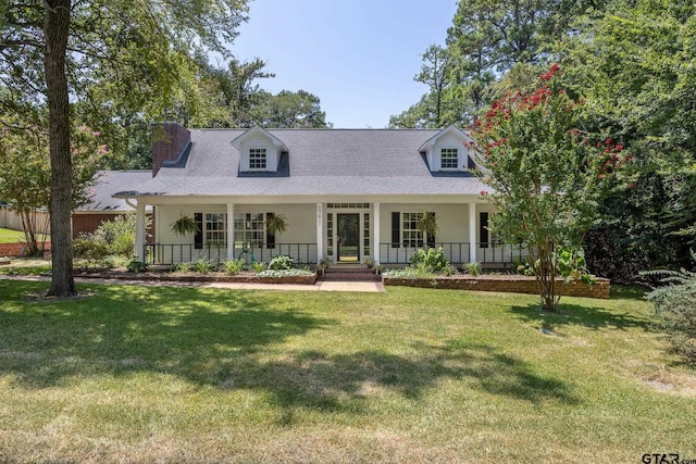 cape cod-style house featuring covered porch and a front yard