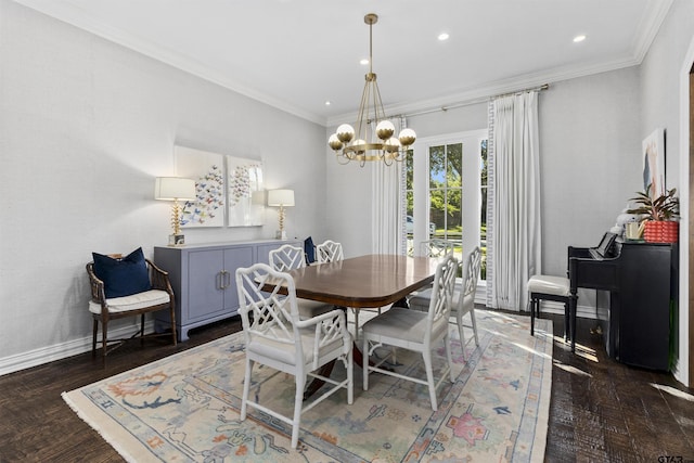 dining room with ornamental molding, dark hardwood / wood-style floors, and an inviting chandelier