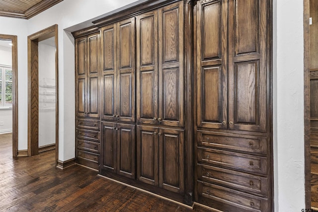 interior details with ornamental molding and hardwood / wood-style floors